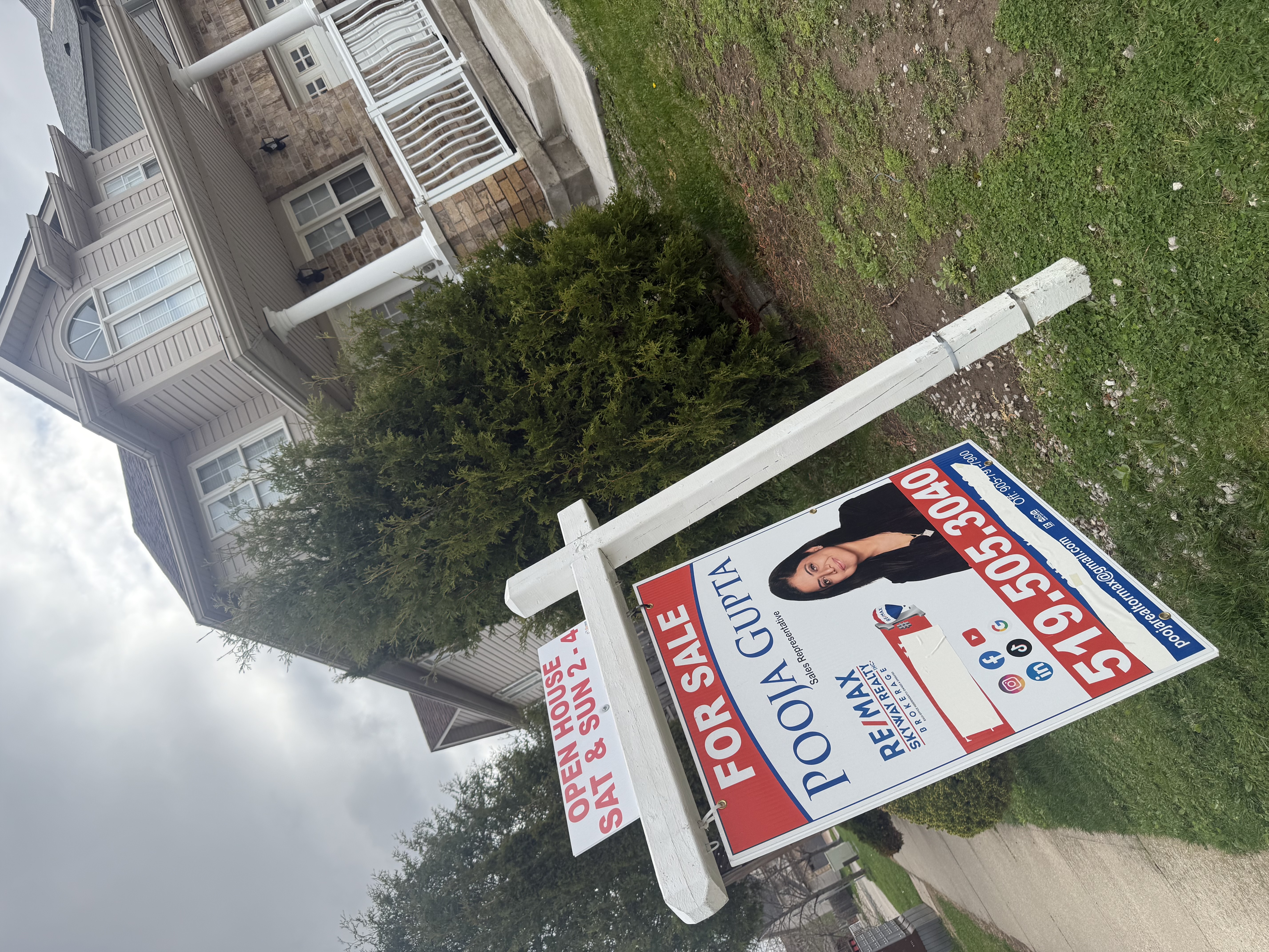 For Sale sign for a Pooja Gupta listing outside a sold home